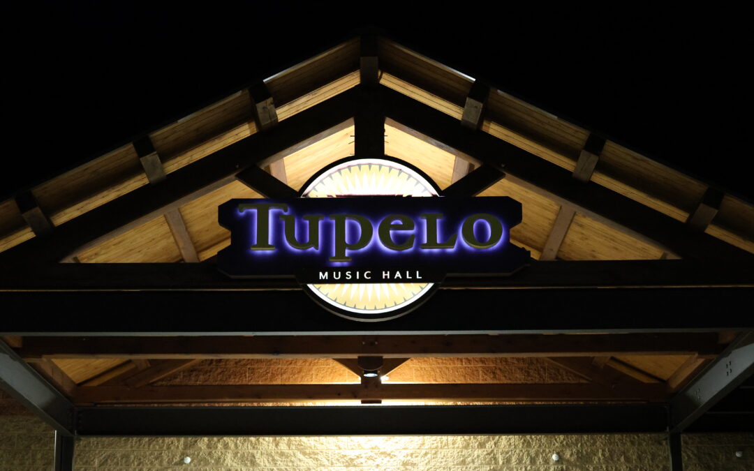 Tupelo exterior entrance at night.