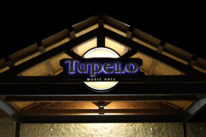 Tupelo exterior entrance at night.